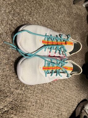 Nike White Athletic Sneakers with Turquoise Laces and Multicolor Stripe